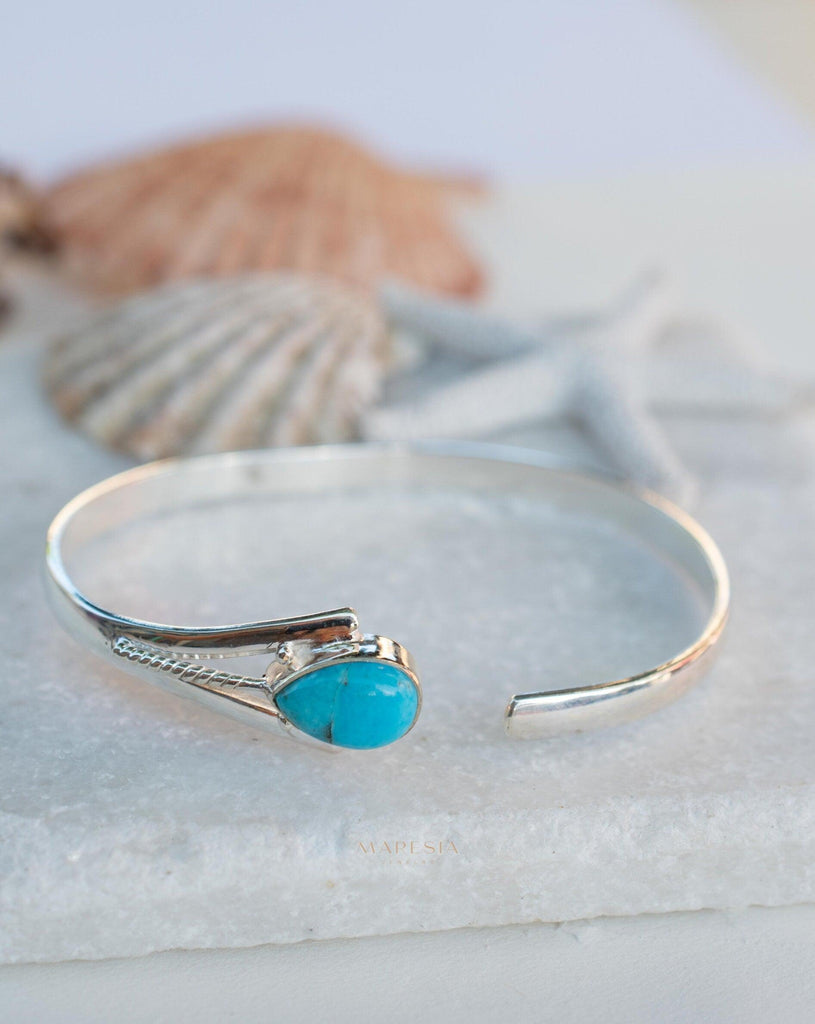 Handcrafted silver and turquoise shops adjustable bracelet.